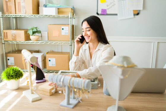 A woman selling jewelry from home for blog post best products to sell from home