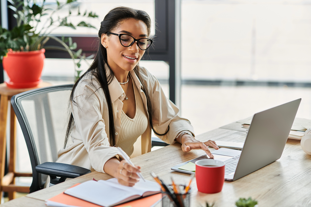 A young woman reading about how to get a work from home job