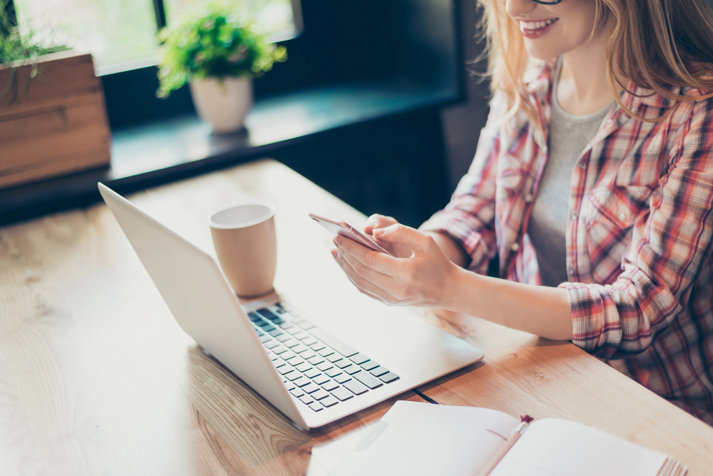 Young woman testing websites and apps for cash